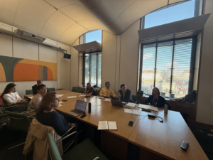 People sit round a table in Parliament